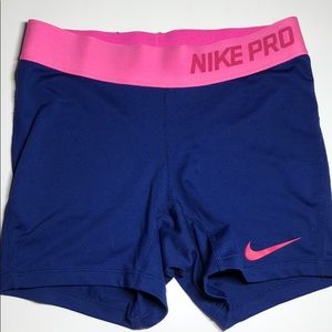 Blue and pink Nike Pros